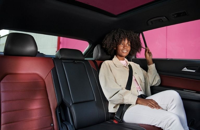 rear seat view of the 2022 VW Atlas with a young girl sitting