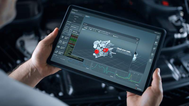 A man viewing an engine diagnostic program on a tablet