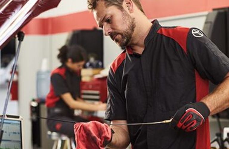 A mechanic working on a vehicle