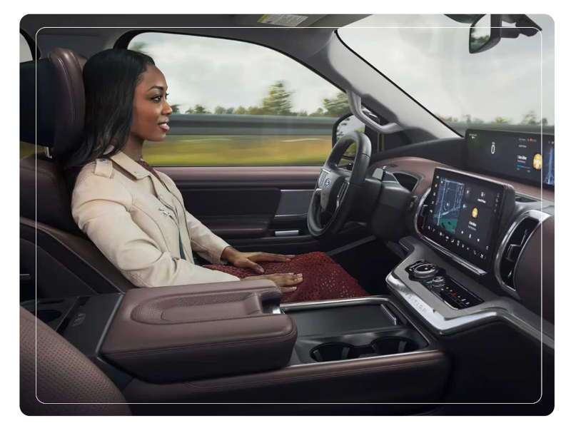 A woman using Ford's Blue Cruise hands-free driving in her 2025 Ford Expedition.