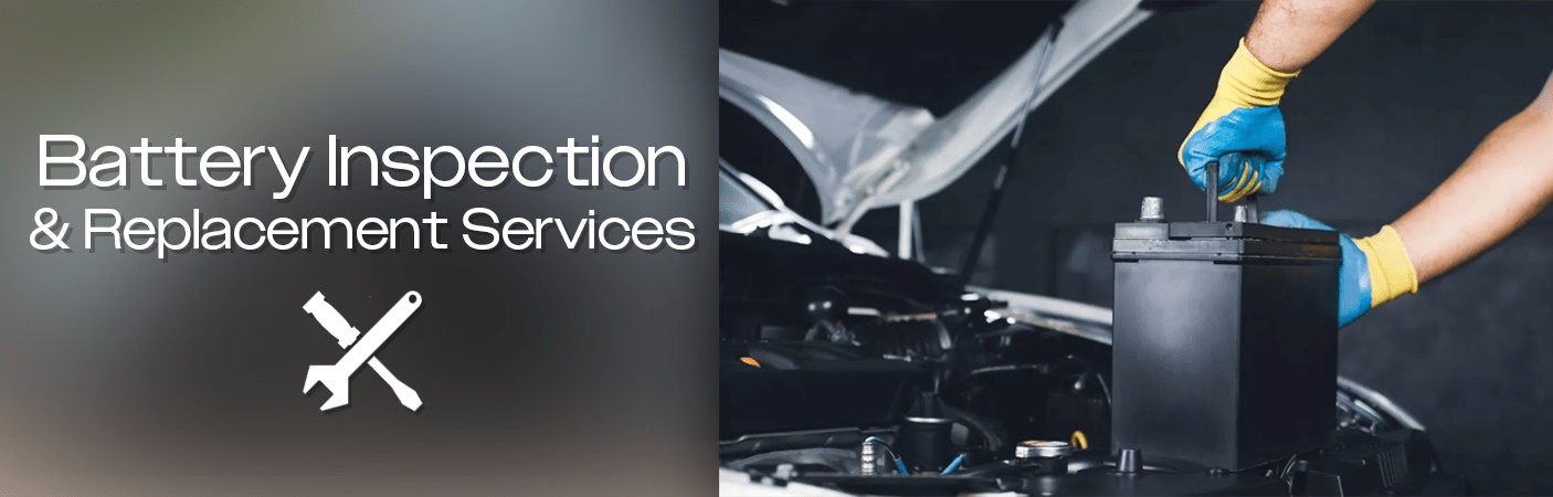 Car Mechanic changing the battery in a vehicle