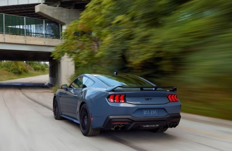 2025 Ford Mustang GT Fastback rear view on a road