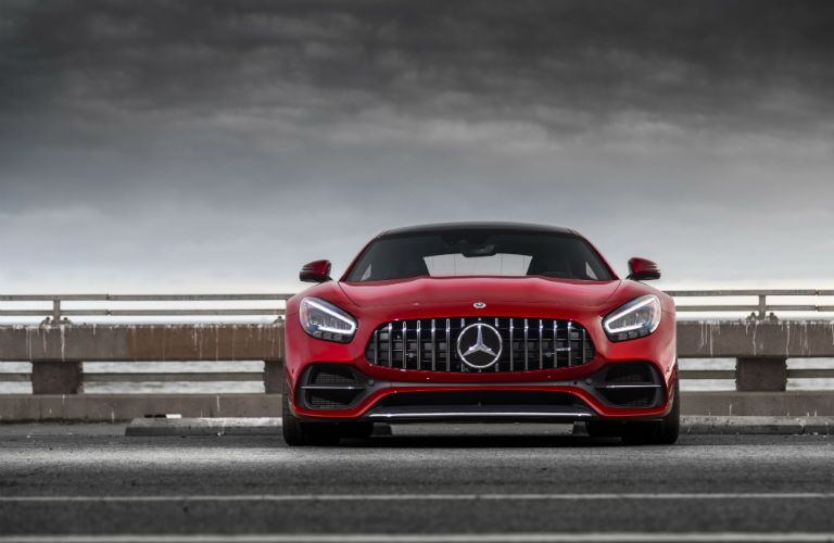 2020 MB GT Coupe exterior front fascia in empty parking lot with cloudy sky