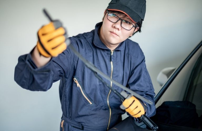 A mechanic working on a vehicle