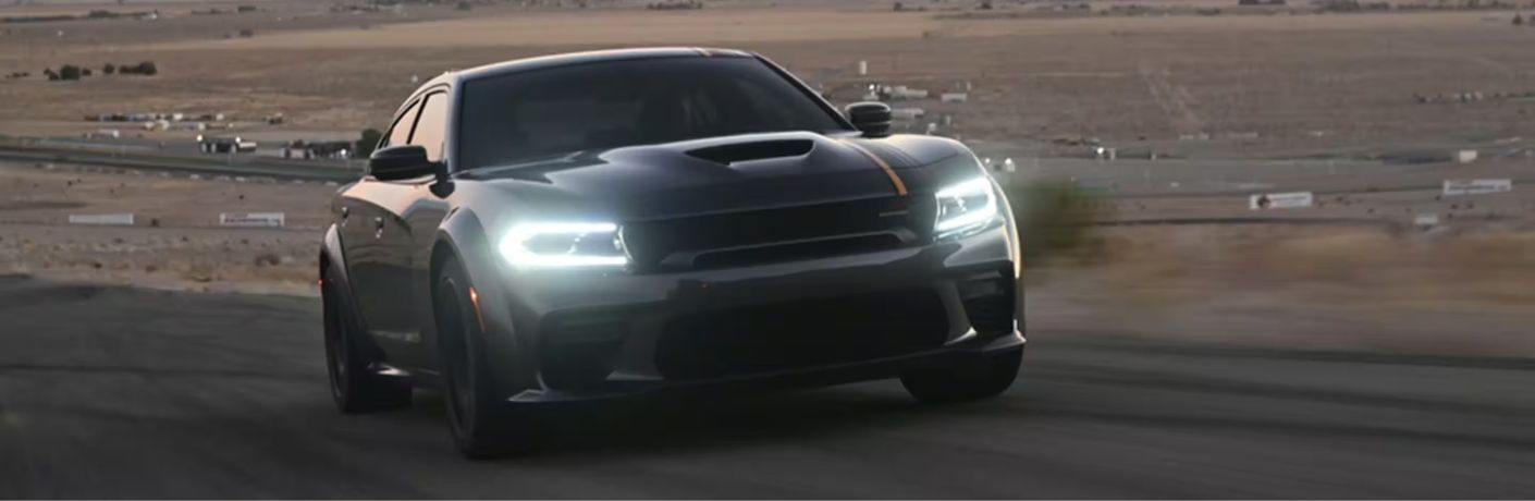2023 Dodge Charger Black driving on the road