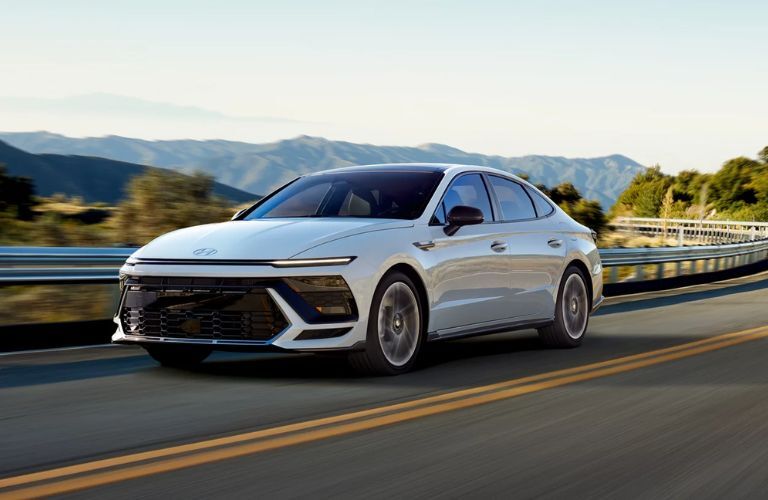 A 2024 Hyundai Sonata speeding on a road