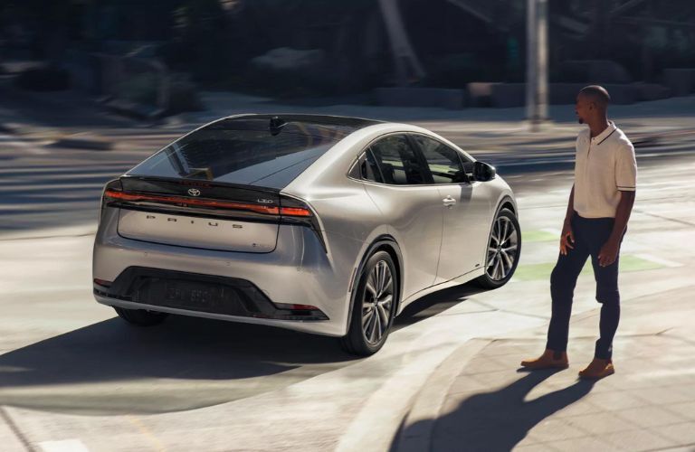 One grey color 2022 Toyota Prius is running on the road.