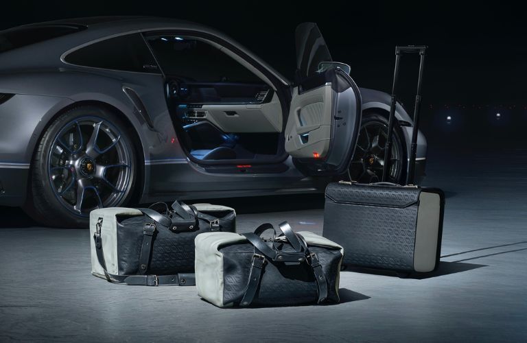 Porsche Bags and Luggage near a Porsche car