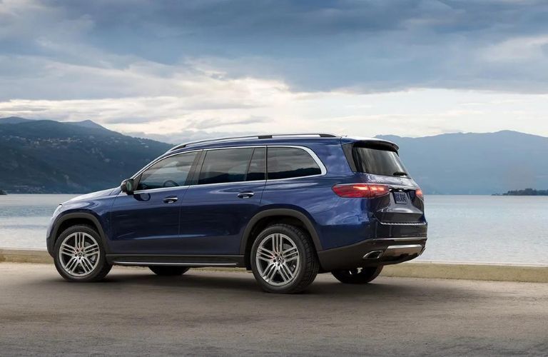 2024 Mercedes-Benz GLS SUV parked on a road near a lake