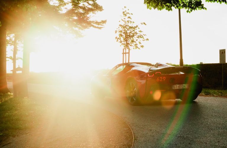 a sun shining on a car
