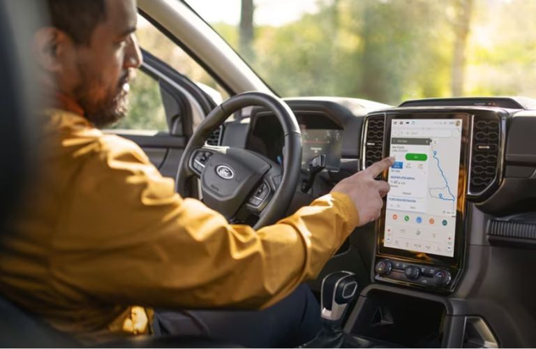 2025 Ford Ranger with a driver using the touchscreen