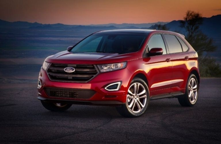 A 2015 Ford Edge backdropped by hills