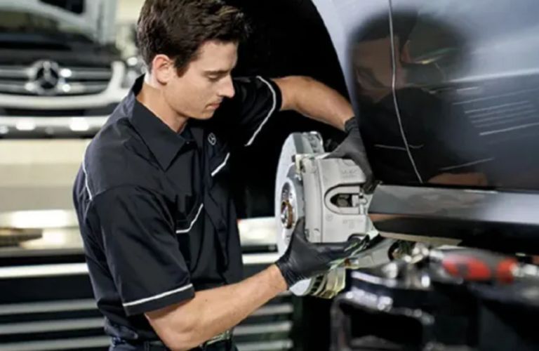 a technician working on a Mercedes-Benz