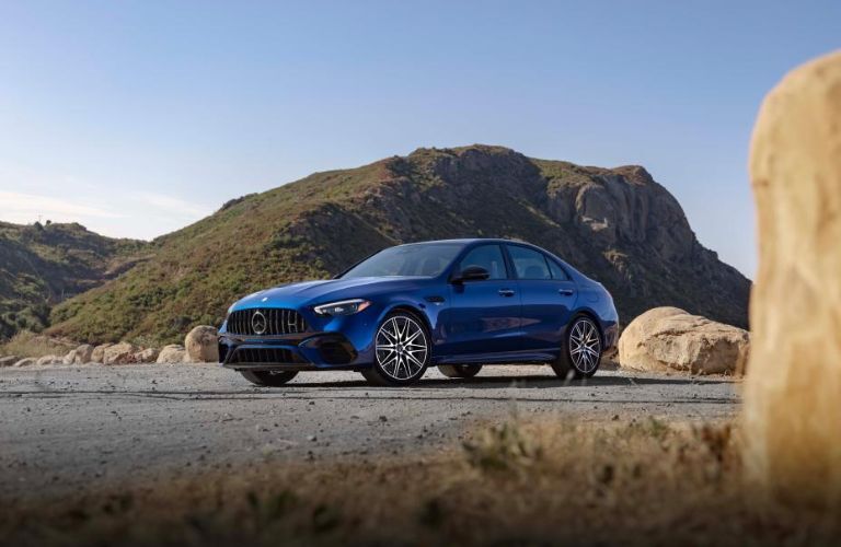 2025 Mercedes-Benz C-Class Sedan Blue parked near mountains