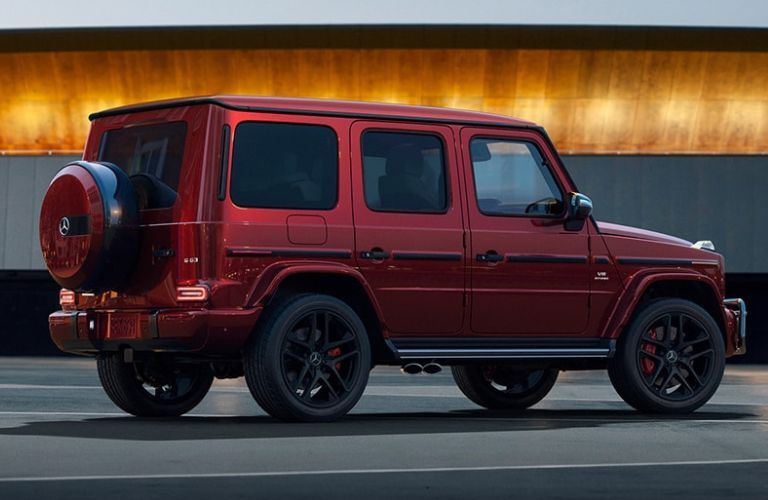 Rear three-quarter view of the 2023 Mercedes-Benz G-Class AMG G 63 SUV Red parked