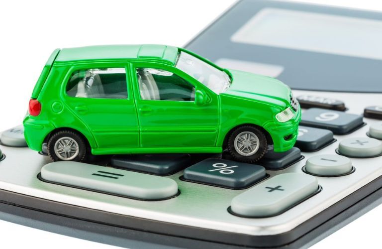 Toy car placed on a calculator