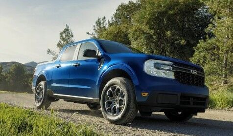 2024 Ford Maverick truck with blue paint on a gravel road