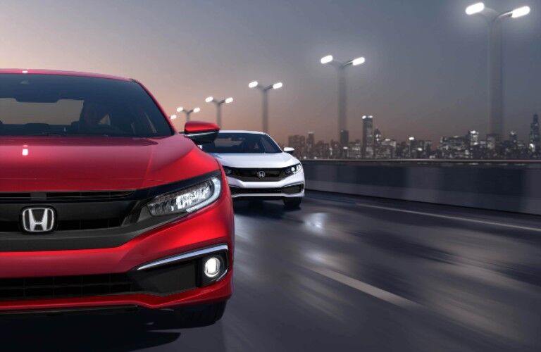 two 2020 Honda Civic Coupe models front view