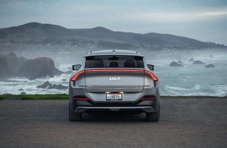 Rear view of the 2022 Kia EV6 near a beach