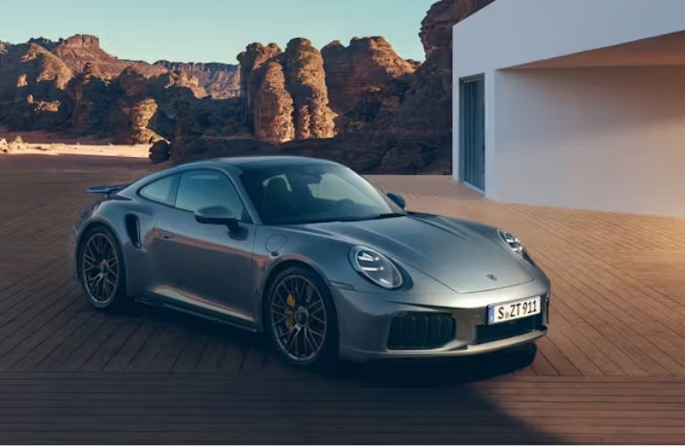 2026 Porsche 911 Turbo S parked outside a house