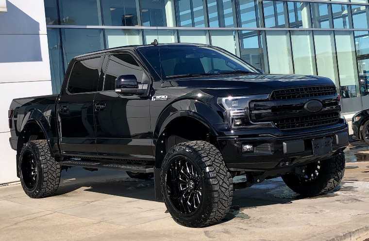 Ford F-150 customized with wheels, tires tint and lift