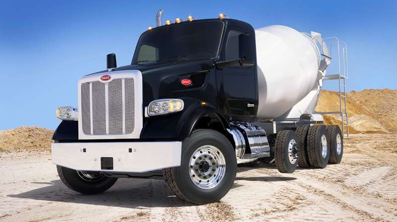 A front quarter exterior view of a Peterbilt cement truck
