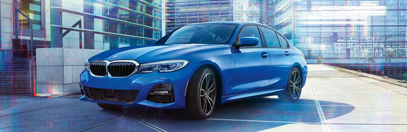 2022 BMW 3 Series with blue paint in a city