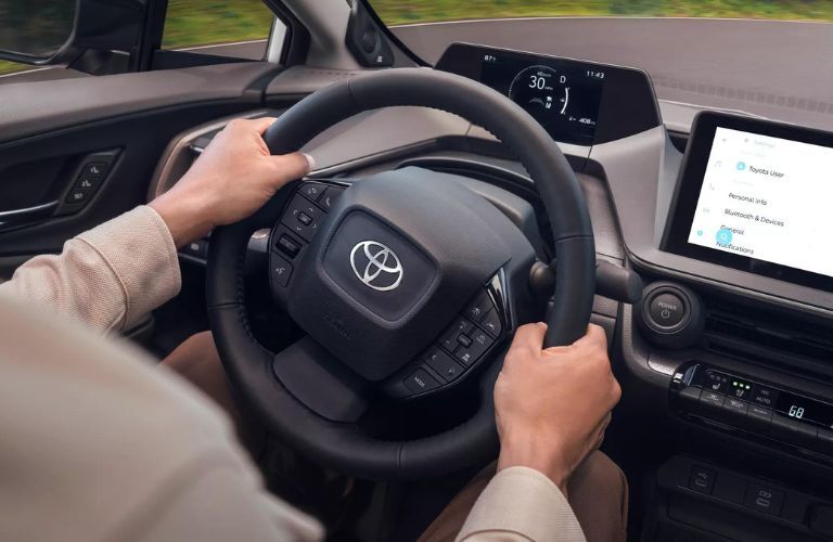 The steering wheel of the 2023 Toyota Prius is shown.