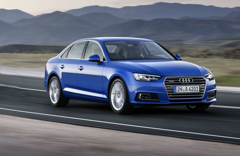 2017 Audi A4 driving past mountains