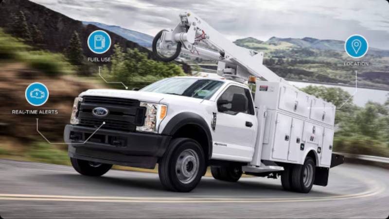 A commercial upfit Ford work truck in crane truck configuration