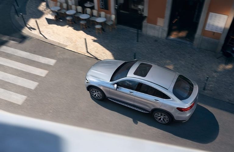 2021 Mercedes-Benz GLC Coupe Birds Eye View zipping through a street