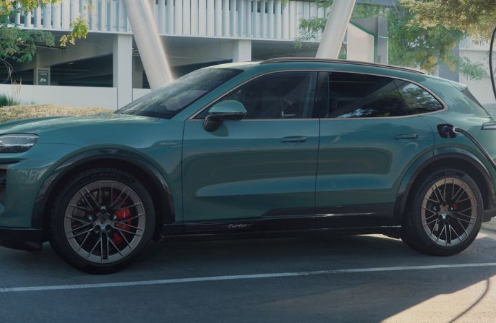 side view of the 2026 Cayenne Electric getting charged