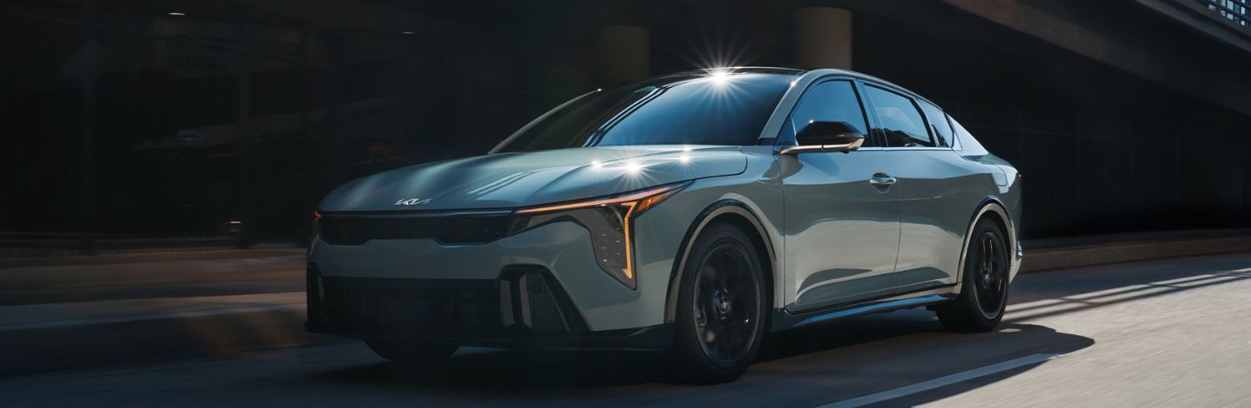 diagonal front view image of the 2025 Kia K4 on a road