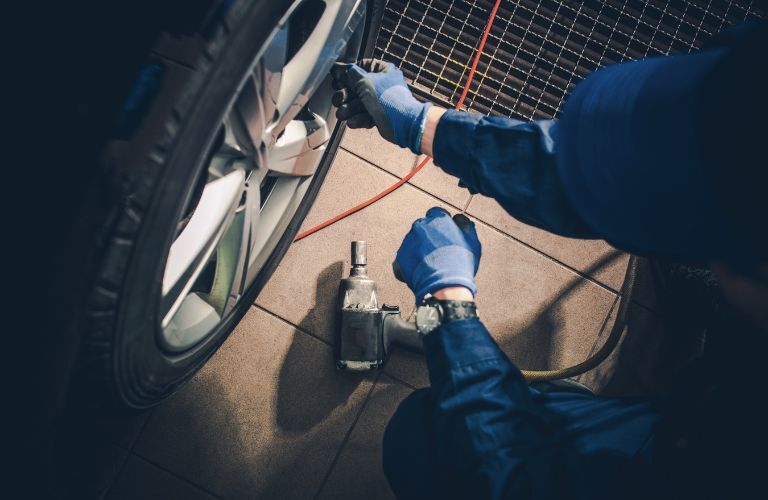 technician adjusting the wheel