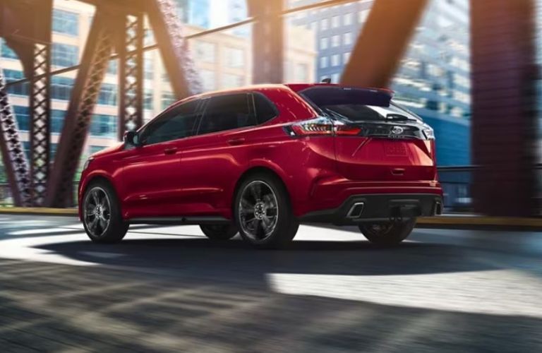 2024 Ford Edge ST rear view driving on a bridge