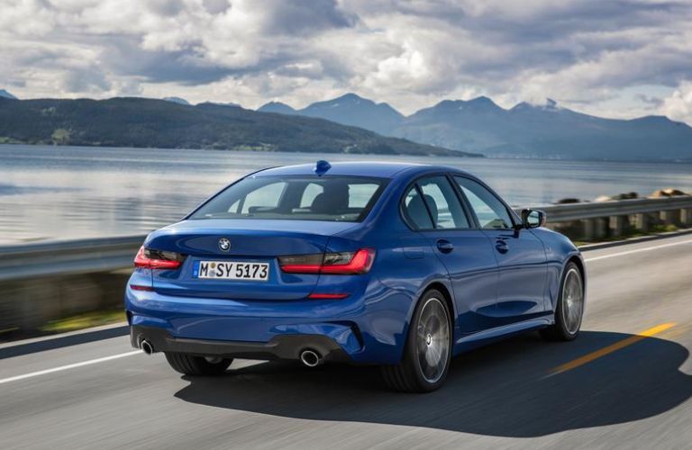 Rear three-quarter view of the 2019 3 BMW Series driving on road