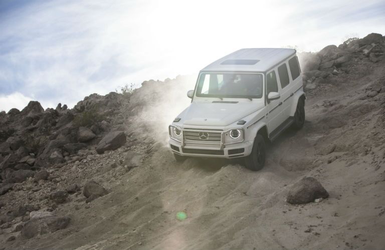 2019 MB G-Class exterior front fascia and driver side driving downhill off road