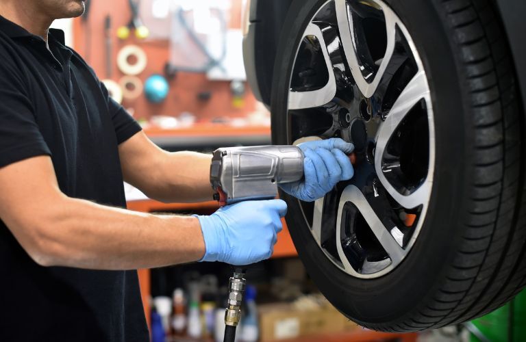 a service technician changing tires