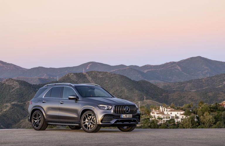 2020 MB GLE exterior front fascia and passenger side in empty lot overlooking mountains and house
