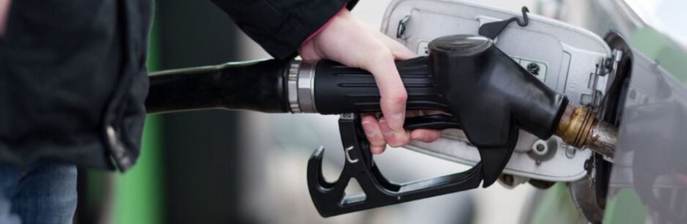 image of a hand pumping fuel