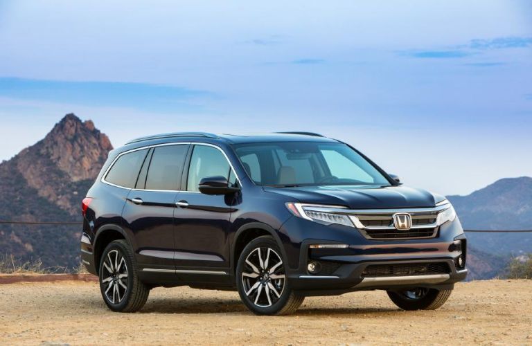 A 2021 Honda Pilot on a gritty terrain