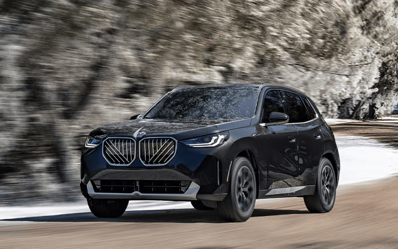 2026 BMW X3 30 xDrive driving in winter front driver's side