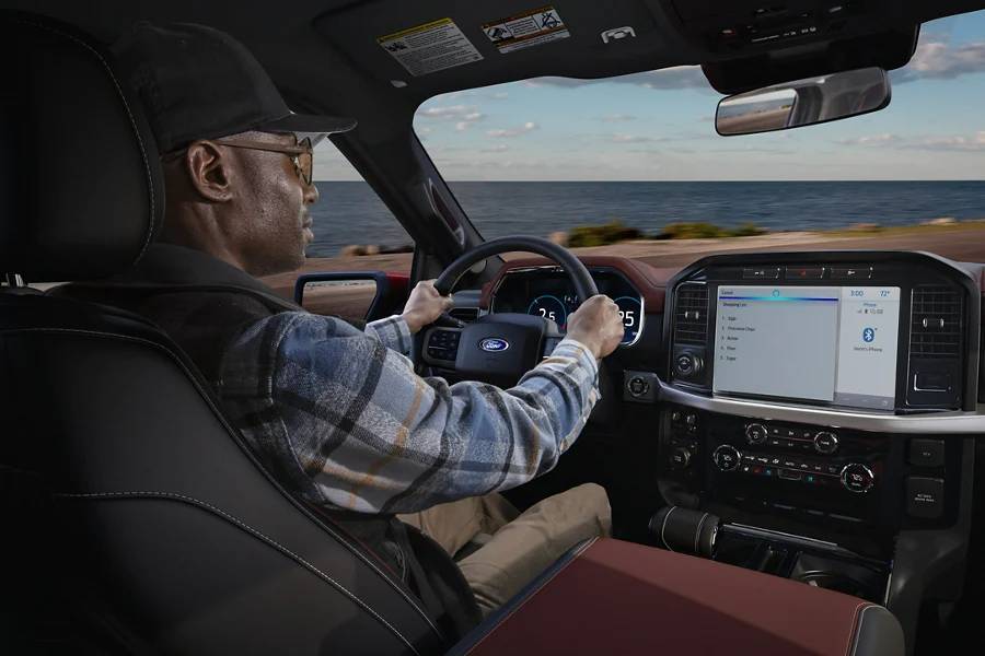 A man driving a truck off-road