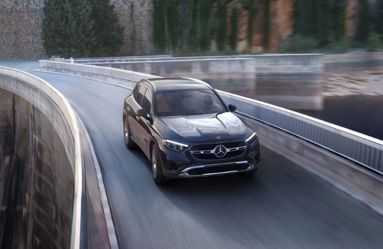 aerial front view image of the 2025 Mercedes-Benz GLC 300 on a road