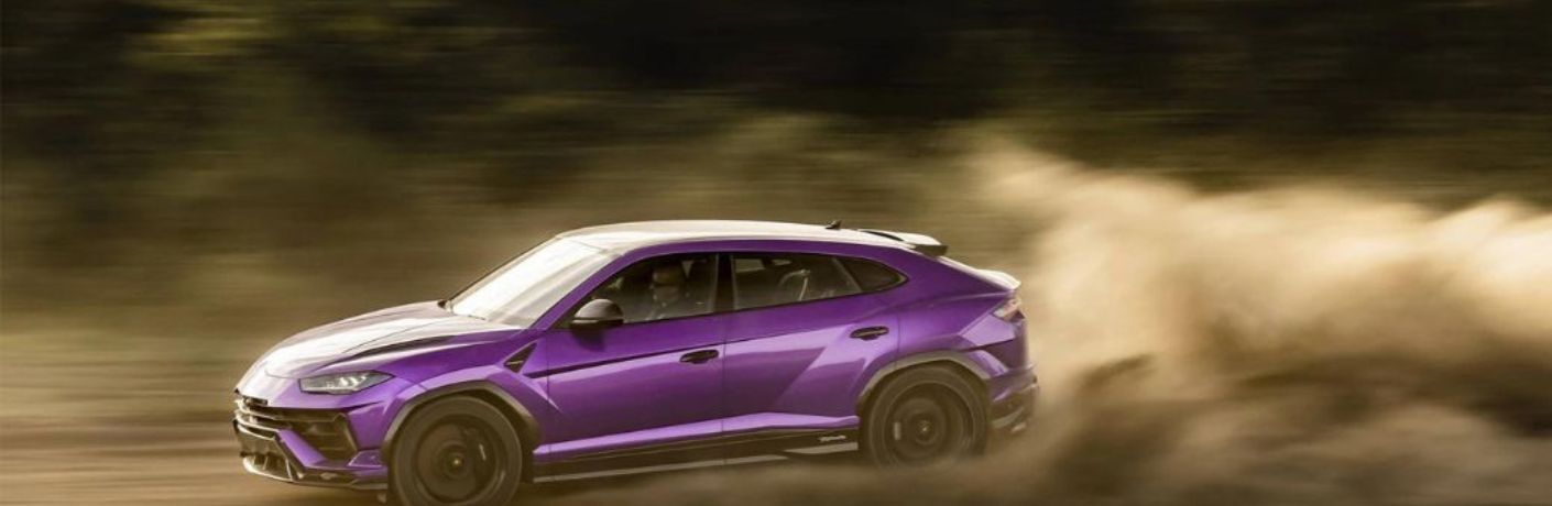 2023 Lamborghini Urus Performante Purple driving on the road