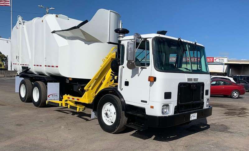 A used side loading garbage truck from Dirt Cheap Truck Sales in Tampa, FL.