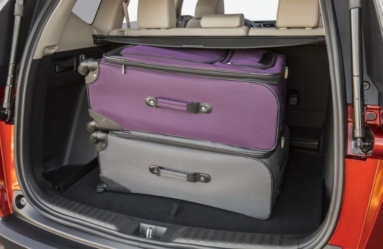 2017 Honda CR-V with two suitcases placed in the trunk space