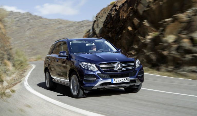 black Mercedes-Benz GLE driving up mountain