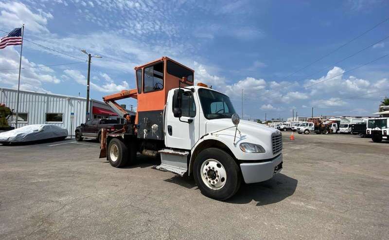 A used Petersen grapple truck from Dirt Cheap Truck Sales in Tampa, FL.