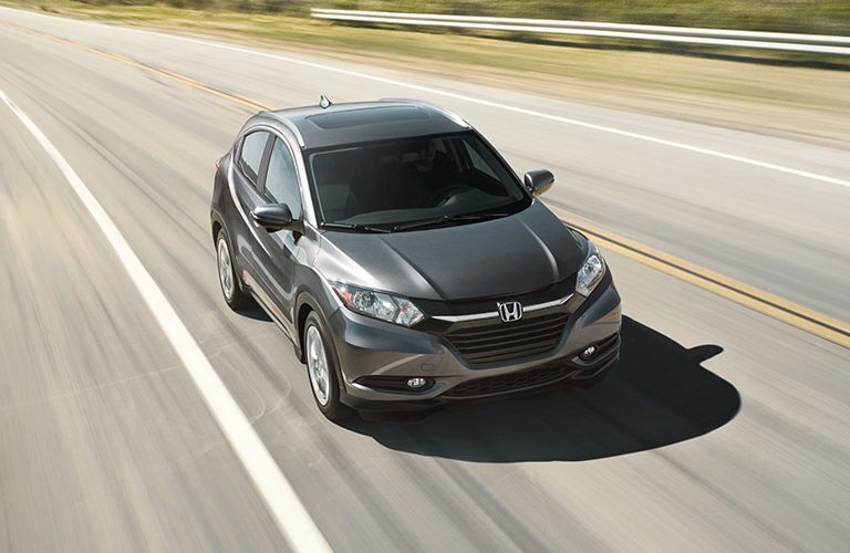 Honda driving down road